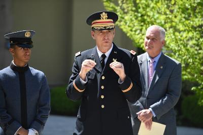 Col. Brad Coleman ’95 remarks on his time with John A. Adams ’71 during a ceremony in Memorial Garden April 22.—VMI Photo by Kelly Nye.