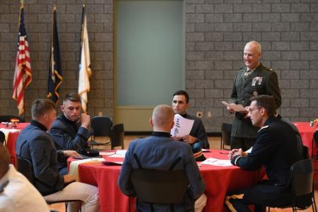 Col. Turk McCleskey and Col. M. Houston Johnson V, professors of history, discuss today’s knowledge of the Constitution with a table of cadets during the Constitution Day event held in Marshall Hall Sept. 20.—VMI Photo by H. Lockwood McLaughlin.