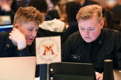 William Shelley ’23, John Barker ’23, and Lynda Toumi ’24 work together during the competition portion of the 2022 Commonwealth Cyber Fusion in Marshall Hall at VMI on Feb. 26.—VMI Photo by H. Lockwood McLaughlin.