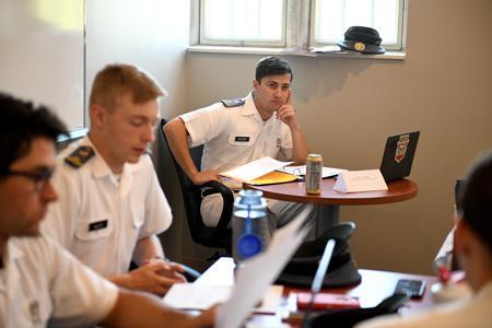 Grayson Galeone ’22 serves as moderator during a debate in, “Democracy and Elections,” a course taught by Col. Howard Sanborn. -VMI Photo by Kelly Nye.