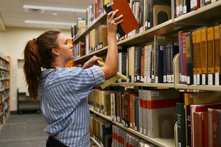 Katie Lloyd ’23 does library research on intelligence for her Summer Undergraduate Research Institute (SURI) project titled, “Toward a Typology of U.S. Intelligence Successes and Failures.”—VMI Photo by Marianne Hause.