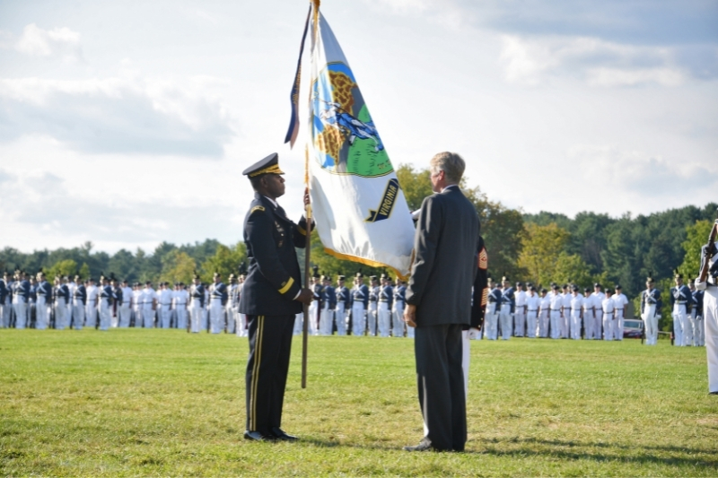 Sgt. Maj. William T. “Tom” Sowers passed the VMI regimental flag to Watjen, who then passed it to Wins.