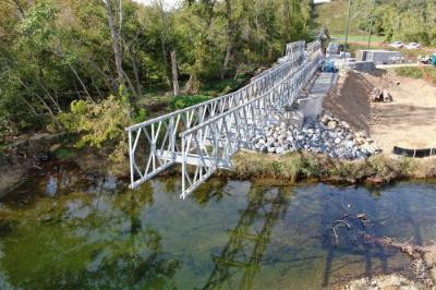 The frame of the Chessie Nature Trail footbridge arches almost halfway across South River as of Oct. 14.—VMI Photo by H. Lockwood McLaughlin.