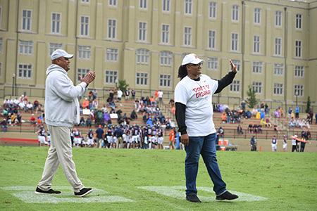 Mildred Cooper ’05, the first female inducted into the VMI Sports Hall of Fame, joins Zack Scott, track and field and cross country director, on the field in Foster Stadium during a special recognition Sept. 10.—VMI Photo by H. Lockwood McLaughlin.