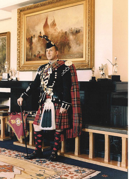 Brian Donaldson stands in Scottish uniform.