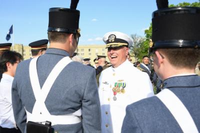 Capt. John E. “Ned” Riester Jr. ’78 receives congratulations from cadets after the retirement parade in April.