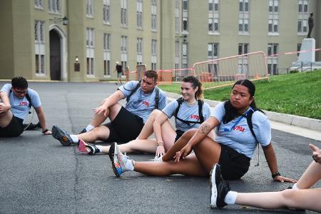 Summer Transition Program participants stretch during morning PT.