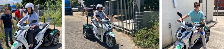 Cadets and instructors on prototype eclectic three-wheel vehicle.