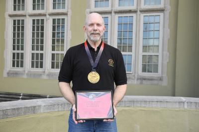 Col. Dan Barr ’74 displays his awards from the United States Powerlifting Coalition.