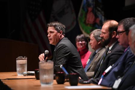 Ryan Brown addresses the assembly during the agency directors panel.