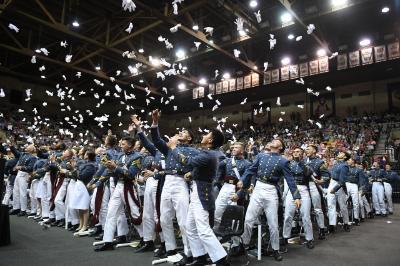 Graduates of VMI celebrate being relieved of duty and completing their cadetship with a traditional glove toss.
