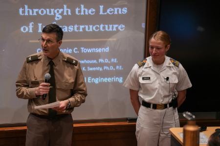 Honors student Annie Townsend '24 presents her senior thesis on the security and history of barracks with her academic advisor, Col. Chuck Newhouse.