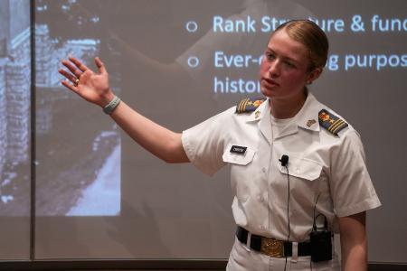 Honors student Annie Townsend '24 presents her senior thesis on the security and history of barracks.