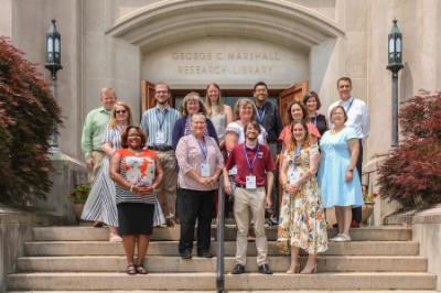 Participants of the professional development seminar stand in front of the George C. Marshall Museum and Library
