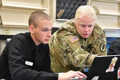 Maj. Molly Kent assists cadet with research