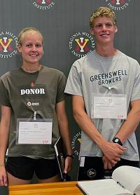 Margaret and David Townsend are official VMI rats after signing the Matriculation Book. -VMI Photo by Marianne Hause.