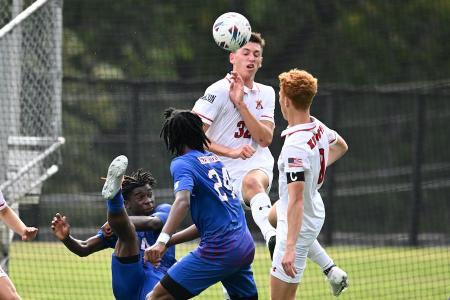 Drew Menges playing center back for VMI's soccer team