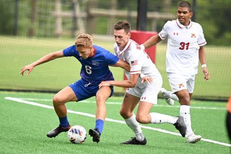 Drew Menges playing center back for VMI's soccer team