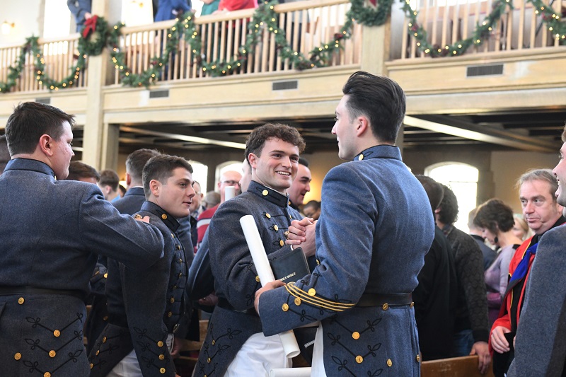 Two students at VMI, known as cadets, celebrate their graduation and transition from cadet to alumnus.