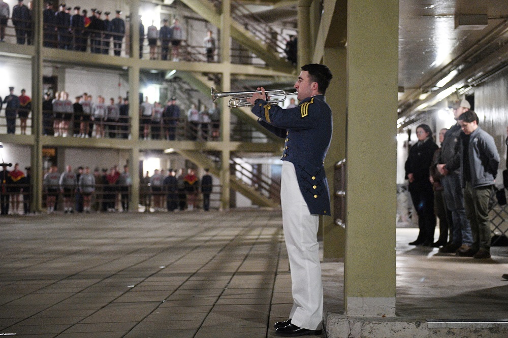 A VMI bugler plays Taps in barracks.