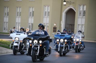 The Virginia American Legion Riders arrive in front of VMI barracks.