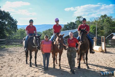 Students with horses in Lexington, part of the VMI Equestrian Club.