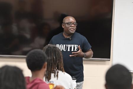 Eugene Williams ’74 teaches life-transforming values and skills to the young men attending COW in July.