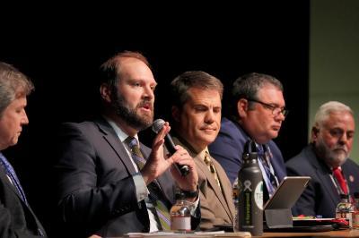 Matthew Wells answers a question during the agency directors panel in Gillis Theater as Rob Farrell, Ryan Brown, Jamie Green, and Mike Rolband listen.