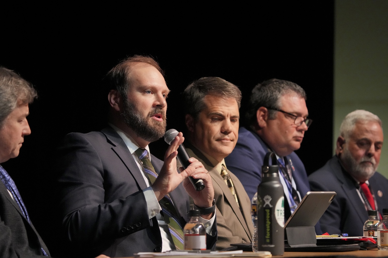 Matthew Wells answers a question during the agency directors panel in Gillis Theater as Rob Farrell, Ryan Brown, Jamie Green, and Mike Rolband listen.