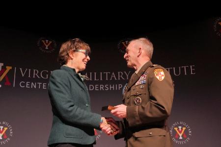 Col. Dave Gray congratulates Tanya Denckla Cobb, this year’s recipient of the Erchul Environmental Leadership Award, in Gillis Theater