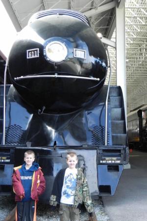 As youngsters, Andrew ’26 and Ryan Quesenberry begin their fascination of trains as they stand in awe of the 611.