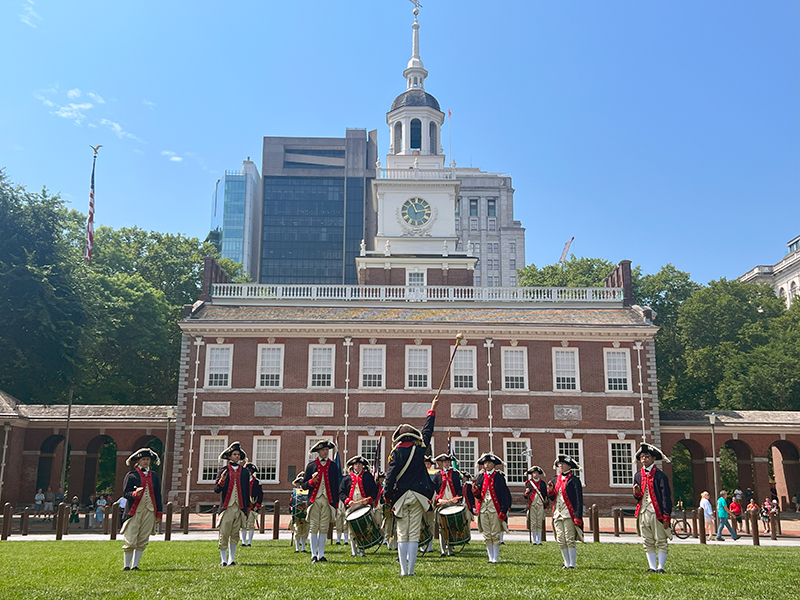 The Plymouth Fife and Drum Corps performs in front of Independence Hall.