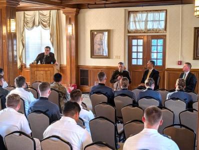 Lt. Col. Mark Boonshoft introduces the panel discussion with Maj. Bryant Etheridge and judges Albert Diaz and A. Marvin Quattlebaum Jr. in Moody Hall.
