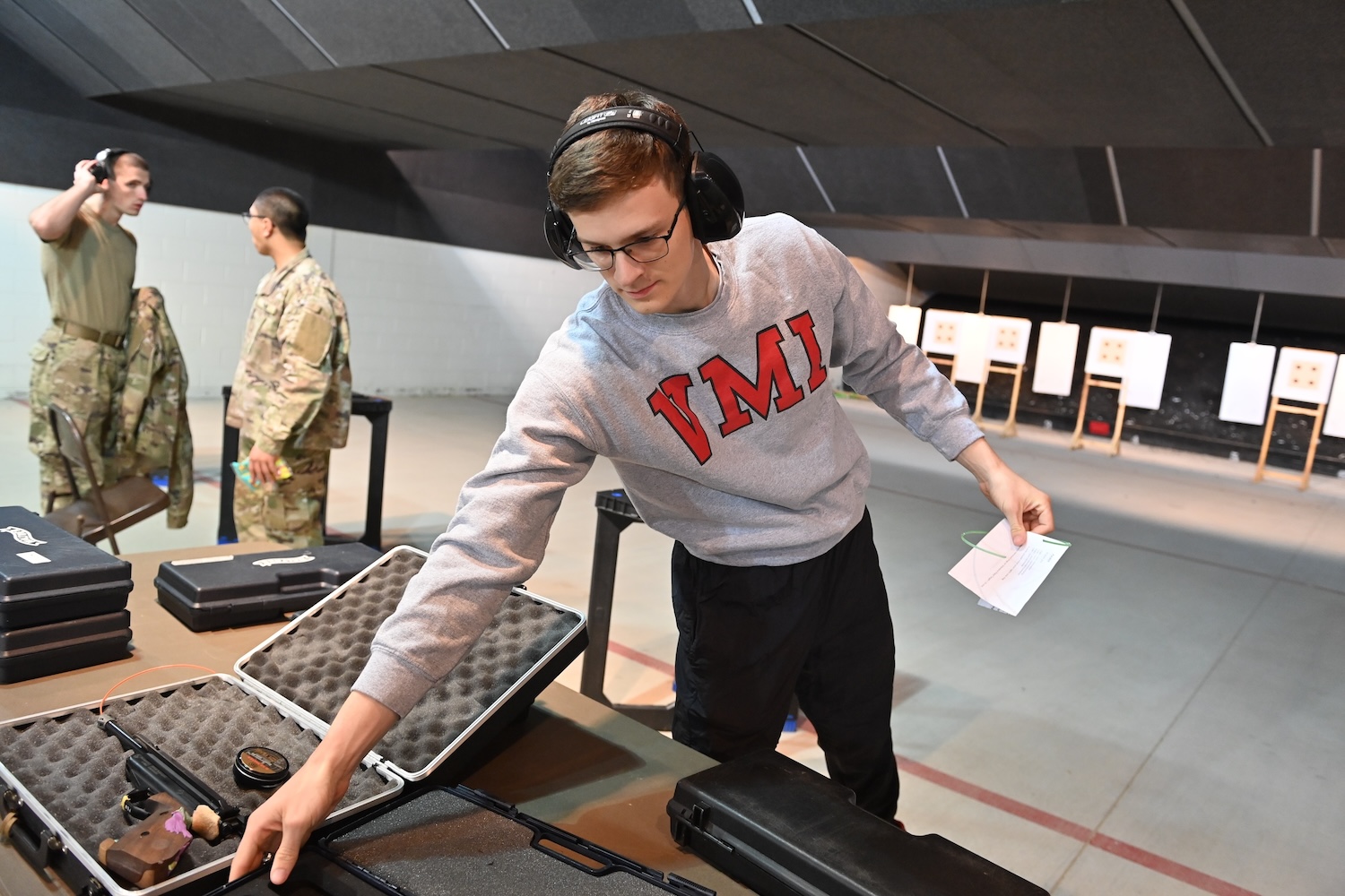 A cadet prepares for practice for the VMI Pistol Club at the shooting range on North Post.