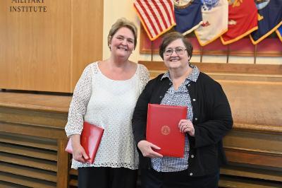 Chris Clark and Marsha Mayhew proudly display their proclamations of appreciation in Memorial Hall.