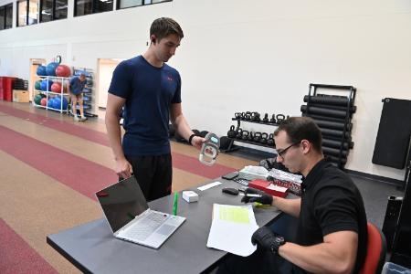 Aidan Carman ’27 shares his grip test results with Colton Shirk ’27.