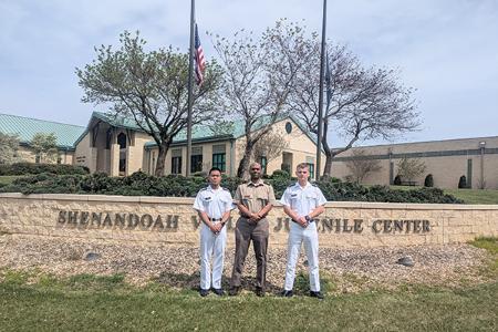 Amiel Diaz ’26, Maj. Aubrey Whitehead, and Alex MacFarlane ’26