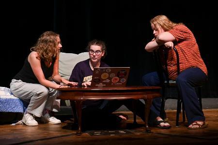 Kristen Pace, Emma Hawes, and Eryn Davis rehearse.