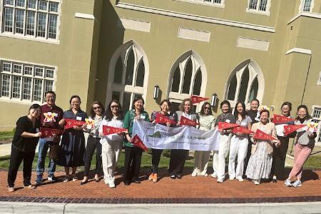 Participants of the CLTA-VA workshop show their support for VMI in front of Scott Shipp Hall.
