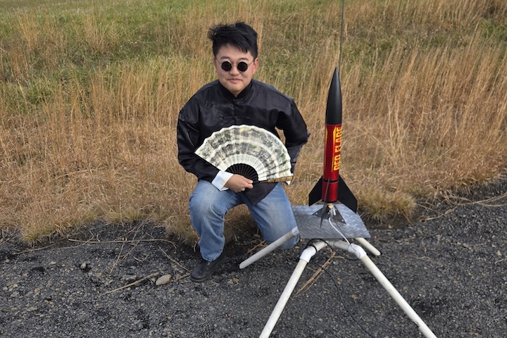 Yushen Zhu ’28 offers a lighthearted nod to Asian culture before launching his rocket at the VAST launch site.