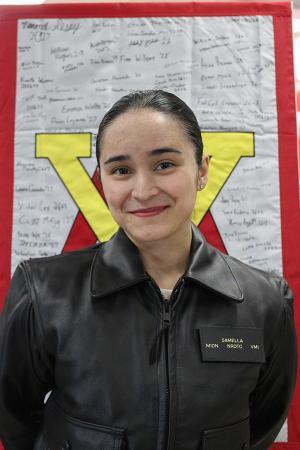 Midshipman 1st Class Nicole Samella, from Virginia Beach, Virginia, and a senior at Virginia Military Institute, poses for a photo after selecting USS Delbert D. Black (DDG 119) as her first ship assignment during the Naval Reserve Officers' Training Corps (NROTC) biannual ship selection ceremony hosted by Navy Personnel Command (PERS-41) Surface Warfare Officer Assignments, Feb. 25.