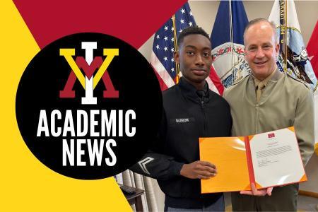Lt. Gen. David Furness ’87 presents a letter of commendation to Dusand Barrow ’28 for his service as an EMT at the football game in Charleston Nov. 1.