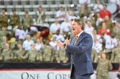 Gov. Glenn Youngkin addresses the Corps of Cadets during halftime in Cameron Hall Dec. 9.
