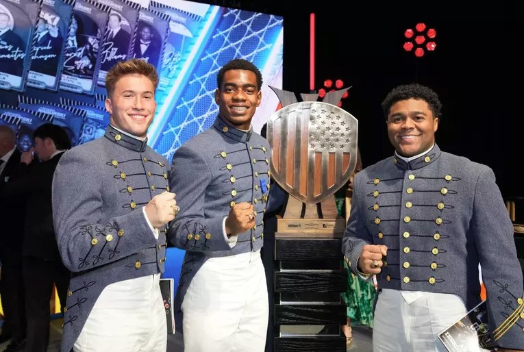 Crump poses with his brother rats at the awards ceremony.