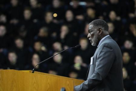 Gene Williams ’74 addresses the Corps of Cadets in Cameron Hall on Founders Day.