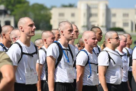 Andrew Kiddie ’29 and his brother rats wait outside the armory during Matriculation Week.