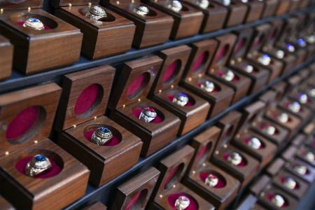 Cadet class rings sit in boxes awaiting the ceremony.