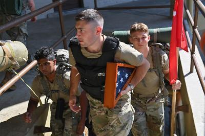A cadet carries an American flag recovered from Ground Zero, during the 9/11 stair climb at VMI Thursday. –VMI Photo by H. Lockwood McLaughlin.