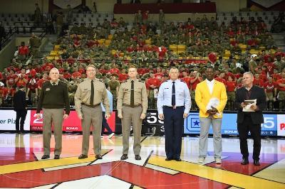 Maj. Isaac Slone and Col. Jeffrey Smith are surrounded by Brig. Gen. Bob Moreschi, Col. Jay Johnson, Jamaal Walton ’07, and Geoff Cabe, senior associate commissioner with SoCon, in Cameron Hall as they are recognized as members of the All-Southern Conference Faulty and Staff Team for the 2025-26 academic year.