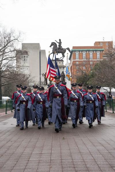 Regimental Commander Devin Auzenne ’26 leads the Corps of Cadets past the Virginia Washington Monument toward the State Capitol Building during the inauguration parade.